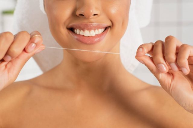flossing to keep teeth healthy for lingual braces